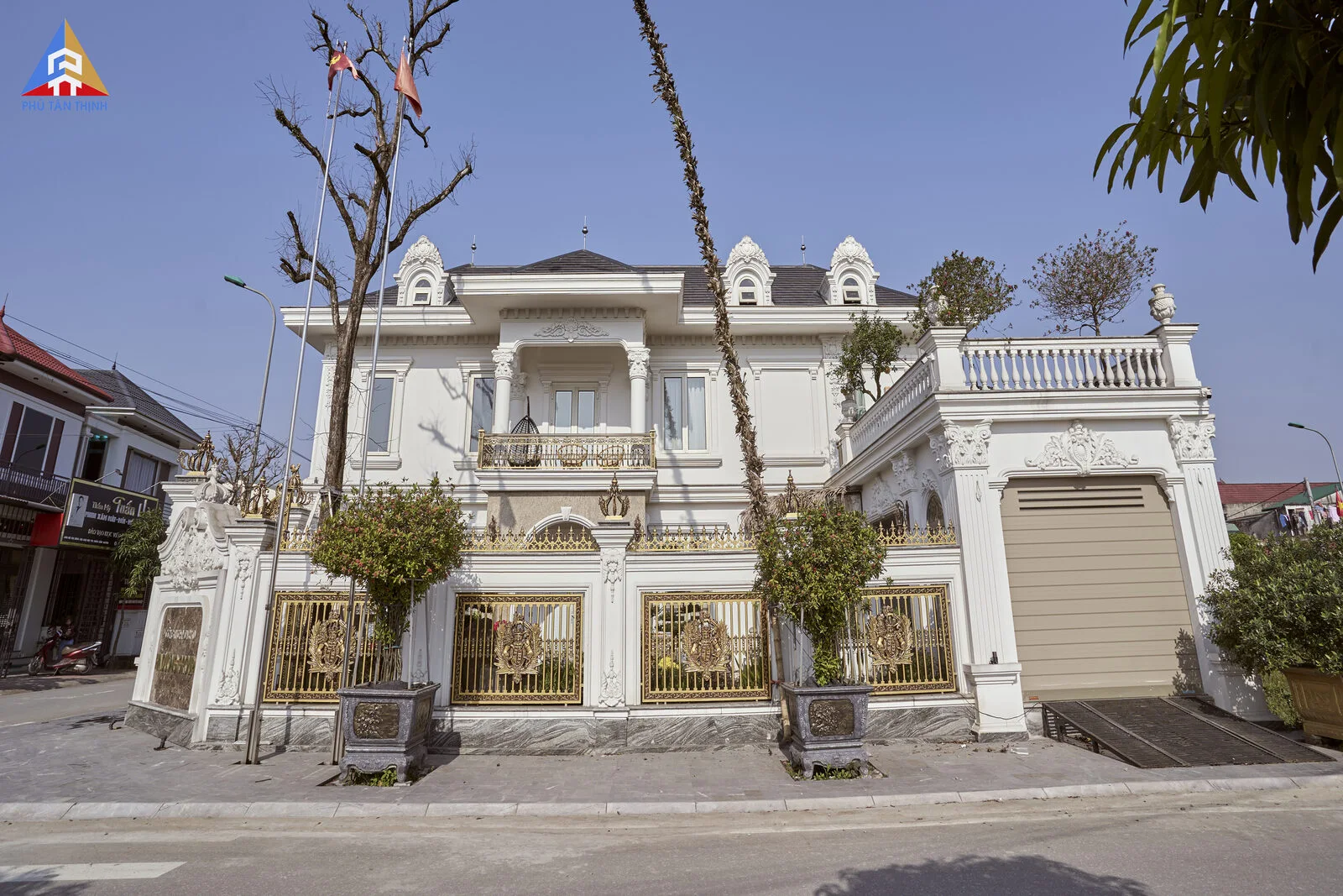 The façade by day — a white neo-classical volume