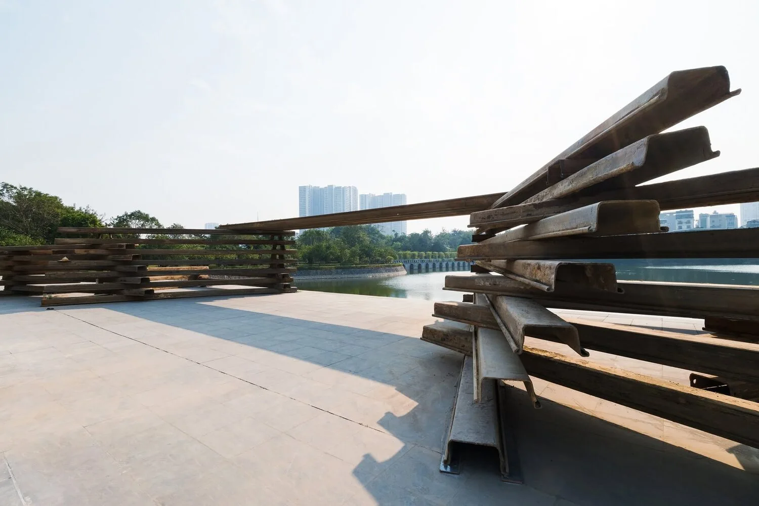Steel pavilion beside the lake — daytime overview