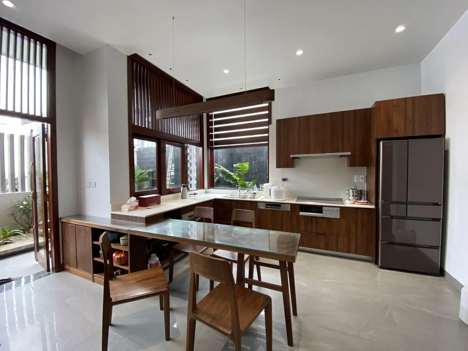 The wood kitchen and dining table catching light