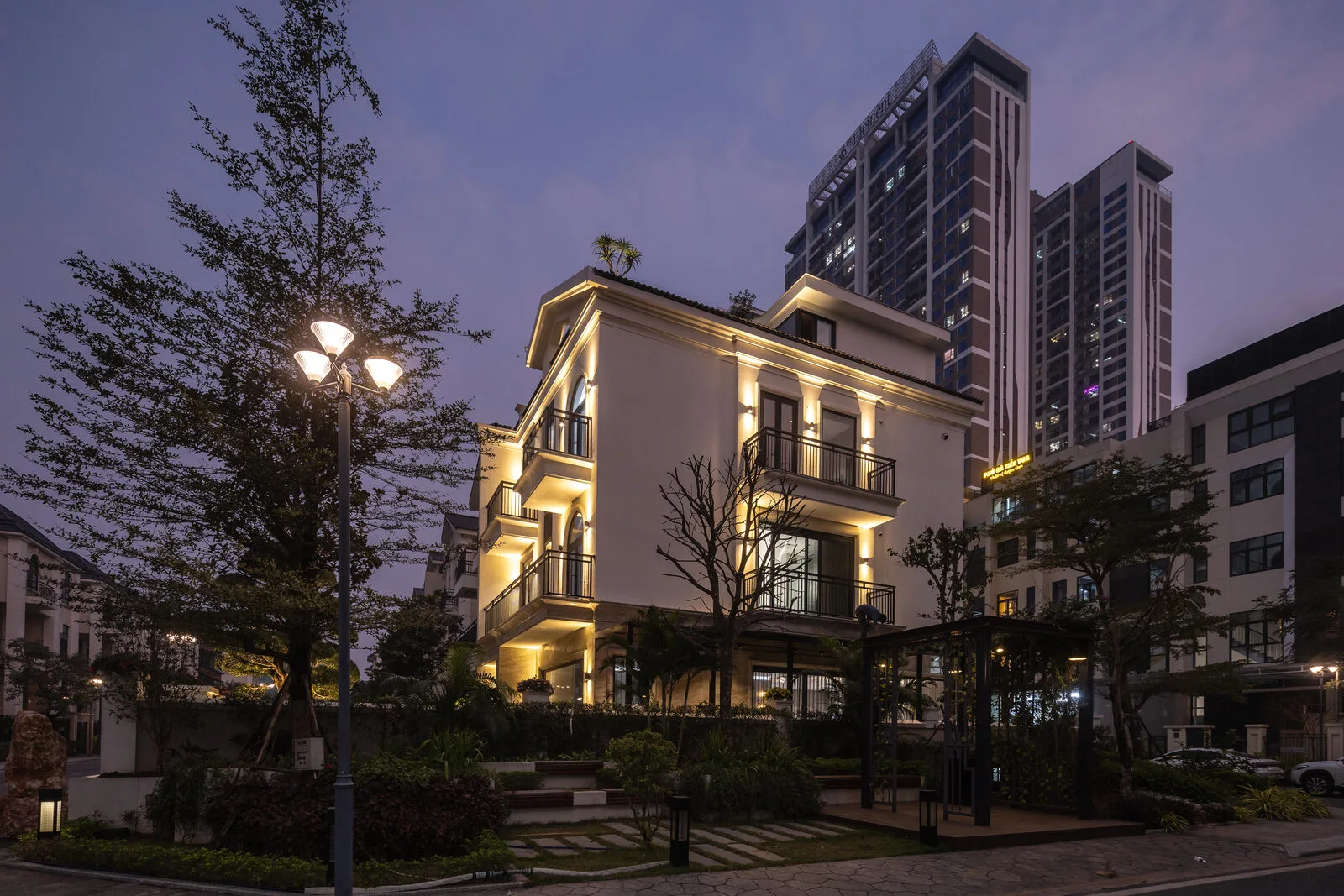 The neoclassical façade lit along the street