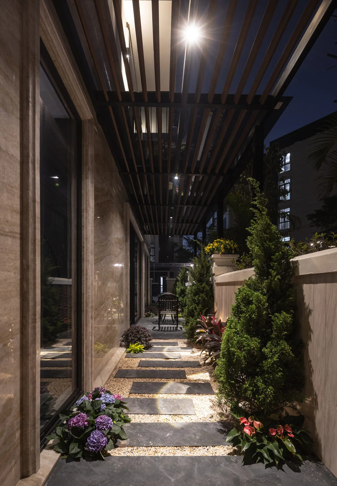 The pergola walkway — light on trees and path