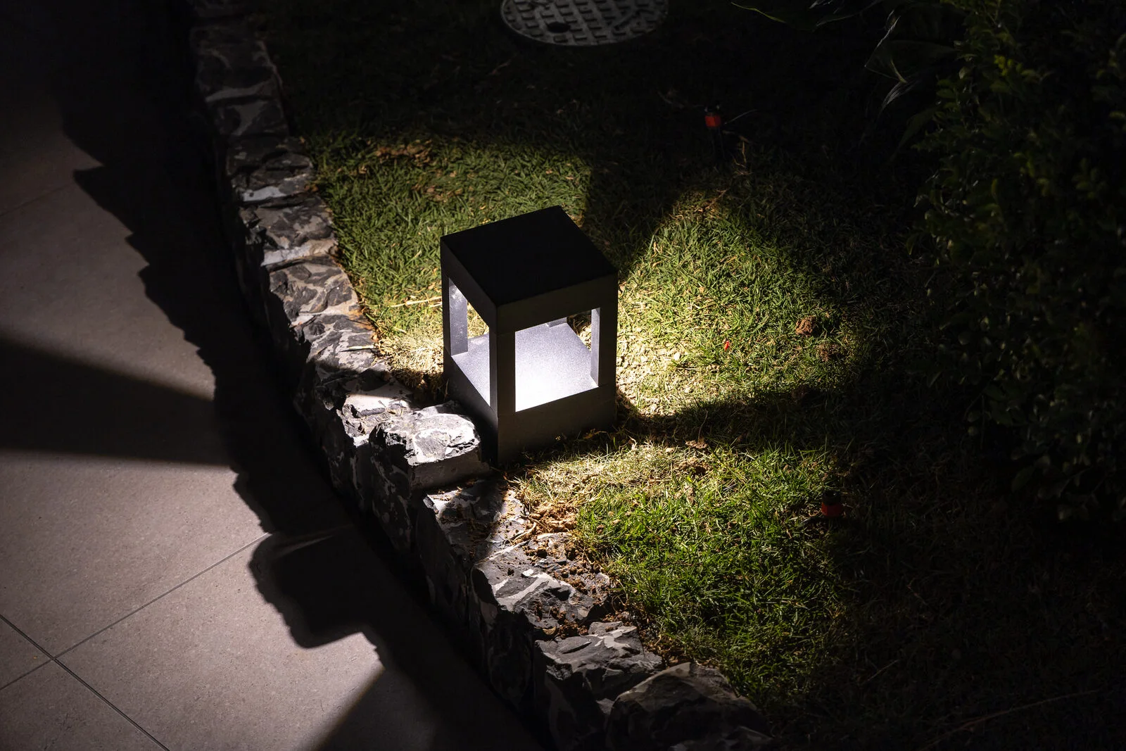 The rooftop — a sculptural arc lamp and city view