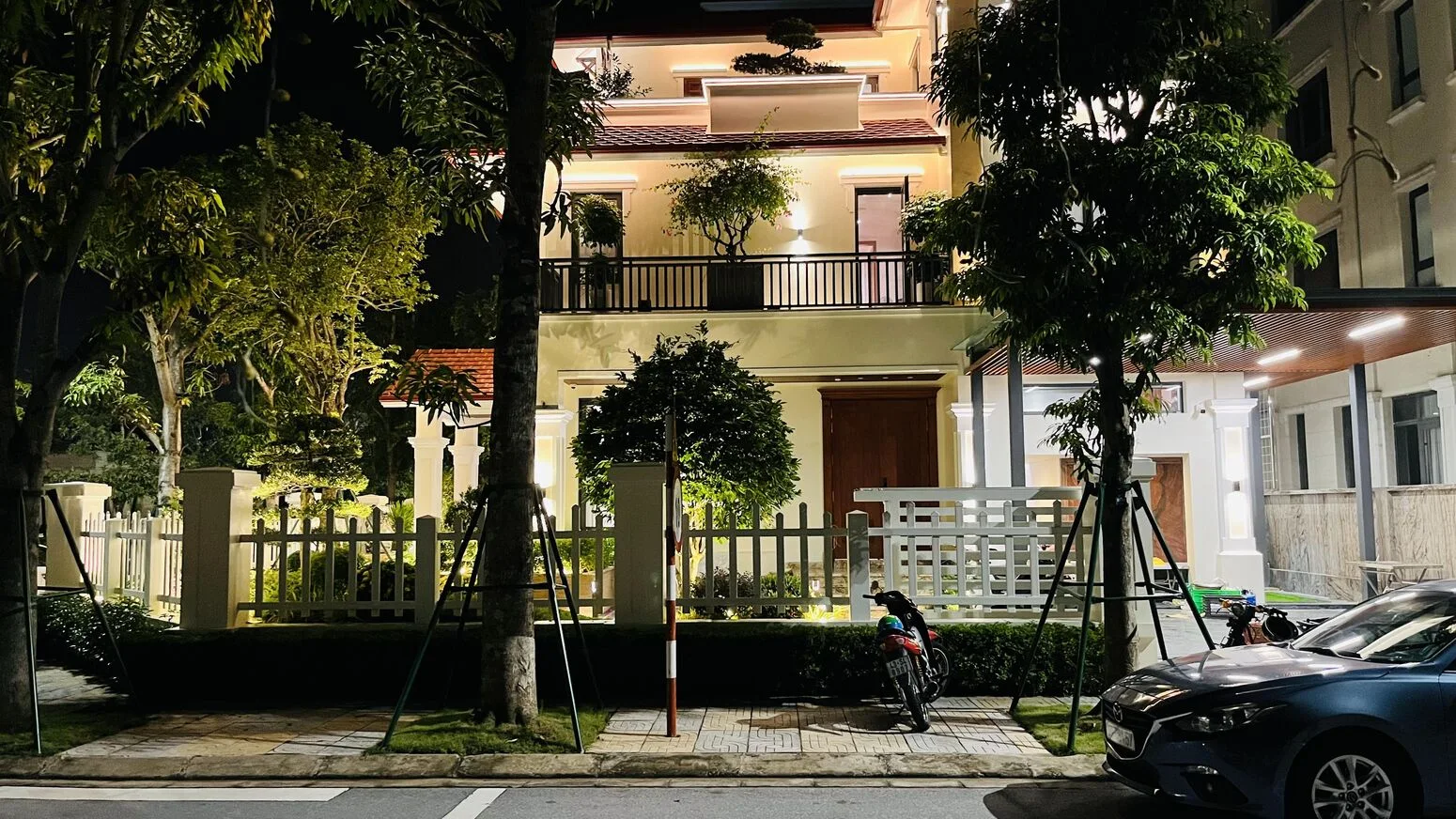 The façade at night with warm light