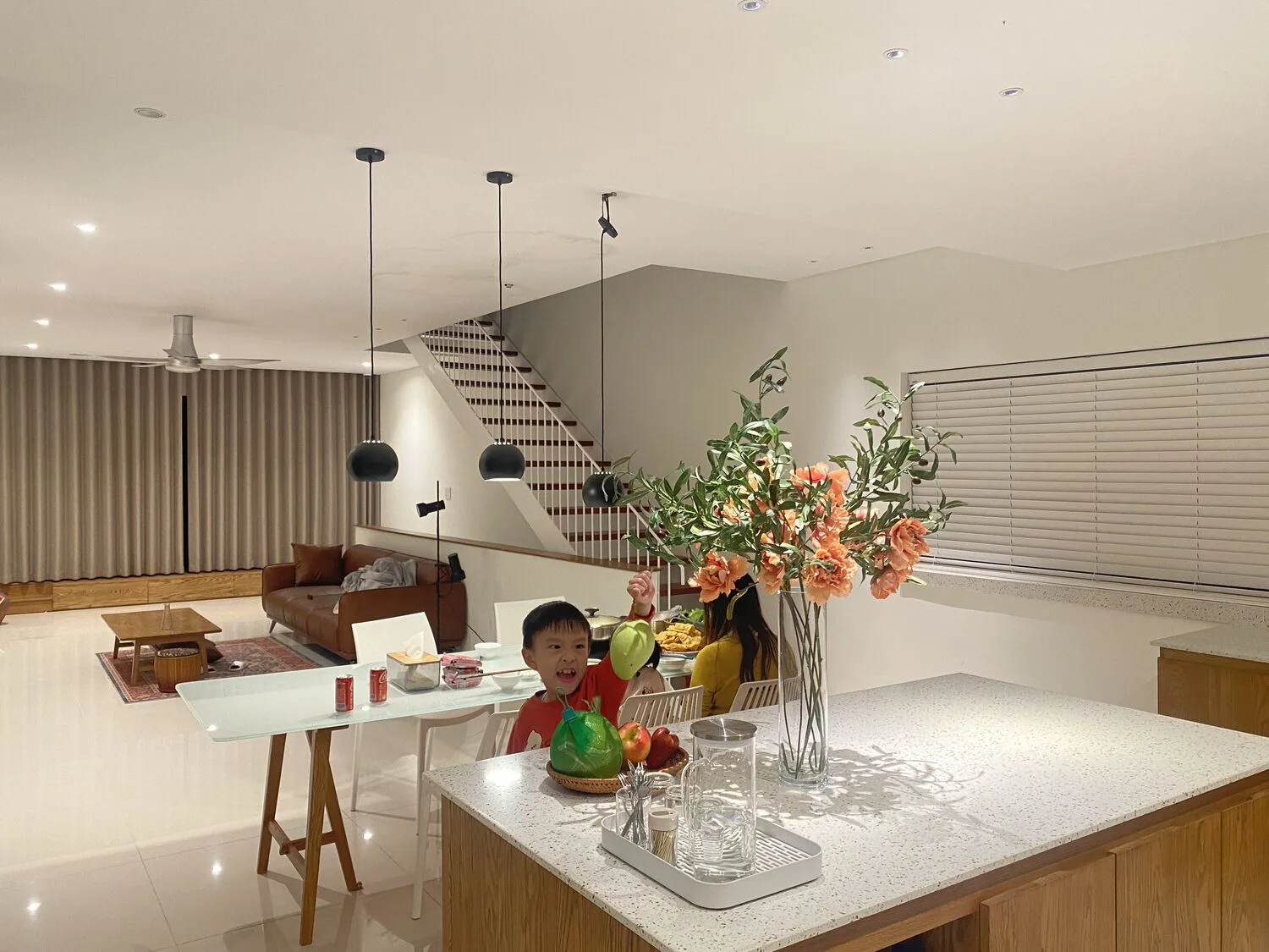 The lit kitchen island, children at play