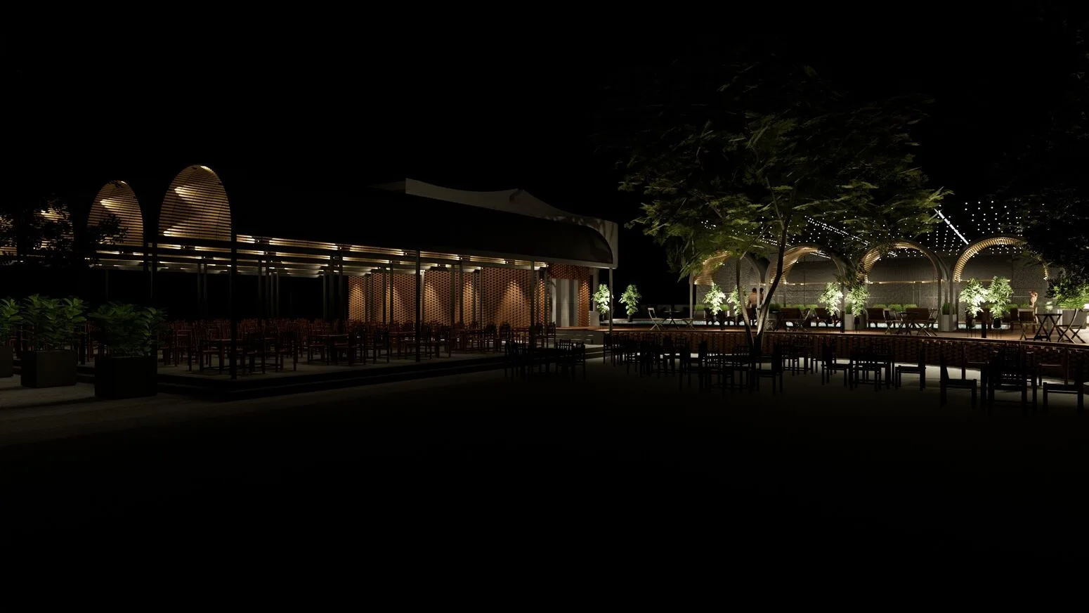 The row of dining pavilions lit at night